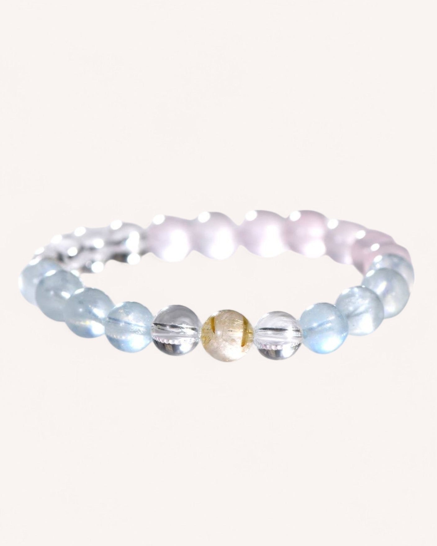 Flat-lay image of love and serenity bracelet with aquamarine, citrine, and rose quartz for energy healing and emotional well-being.