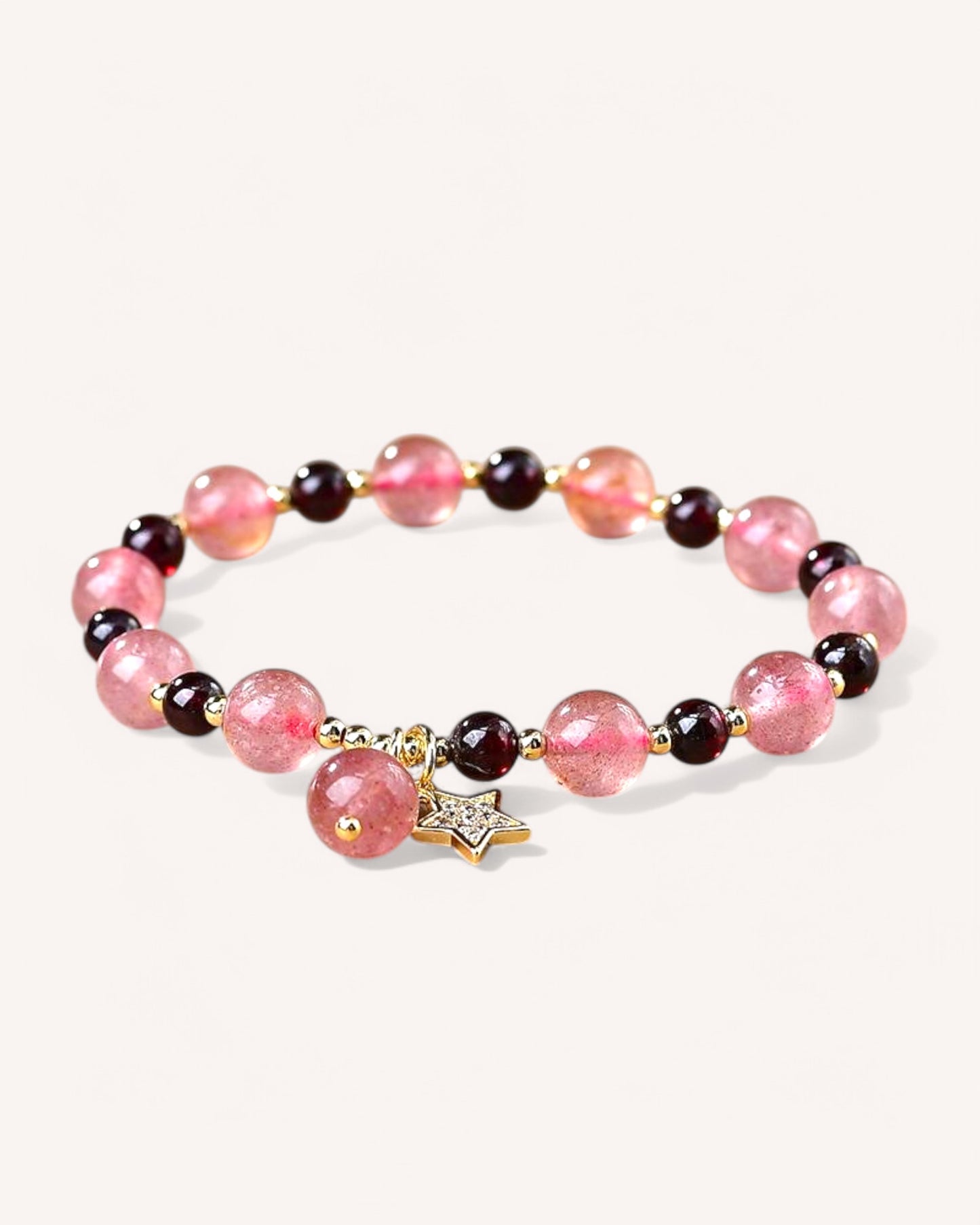 Strawberry Quartz and Garnet Bracelet with gold star charm for love, passion, and emotional balance