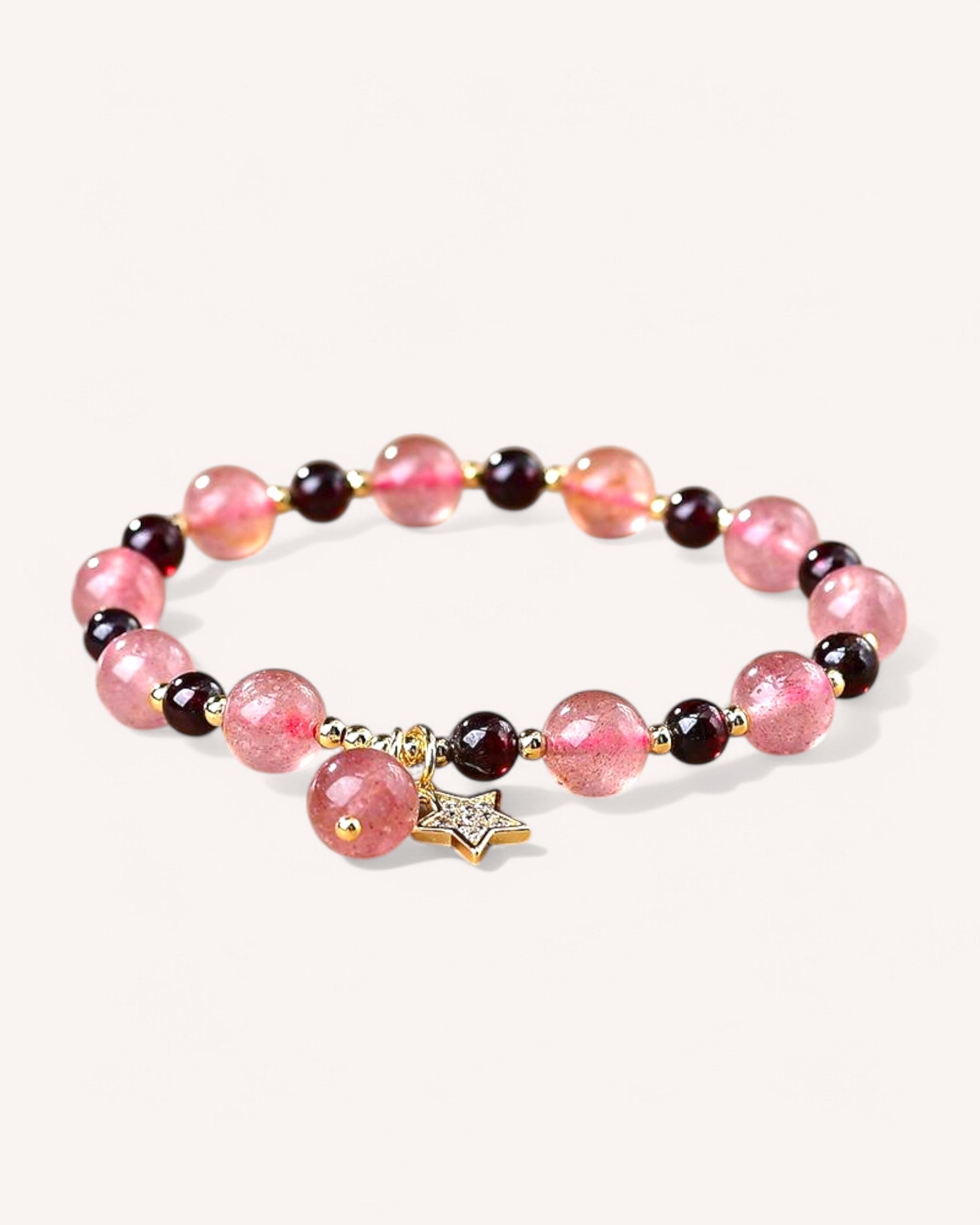 Strawberry Quartz and Garnet Bracelet with gold star charm for love, passion, and emotional balance