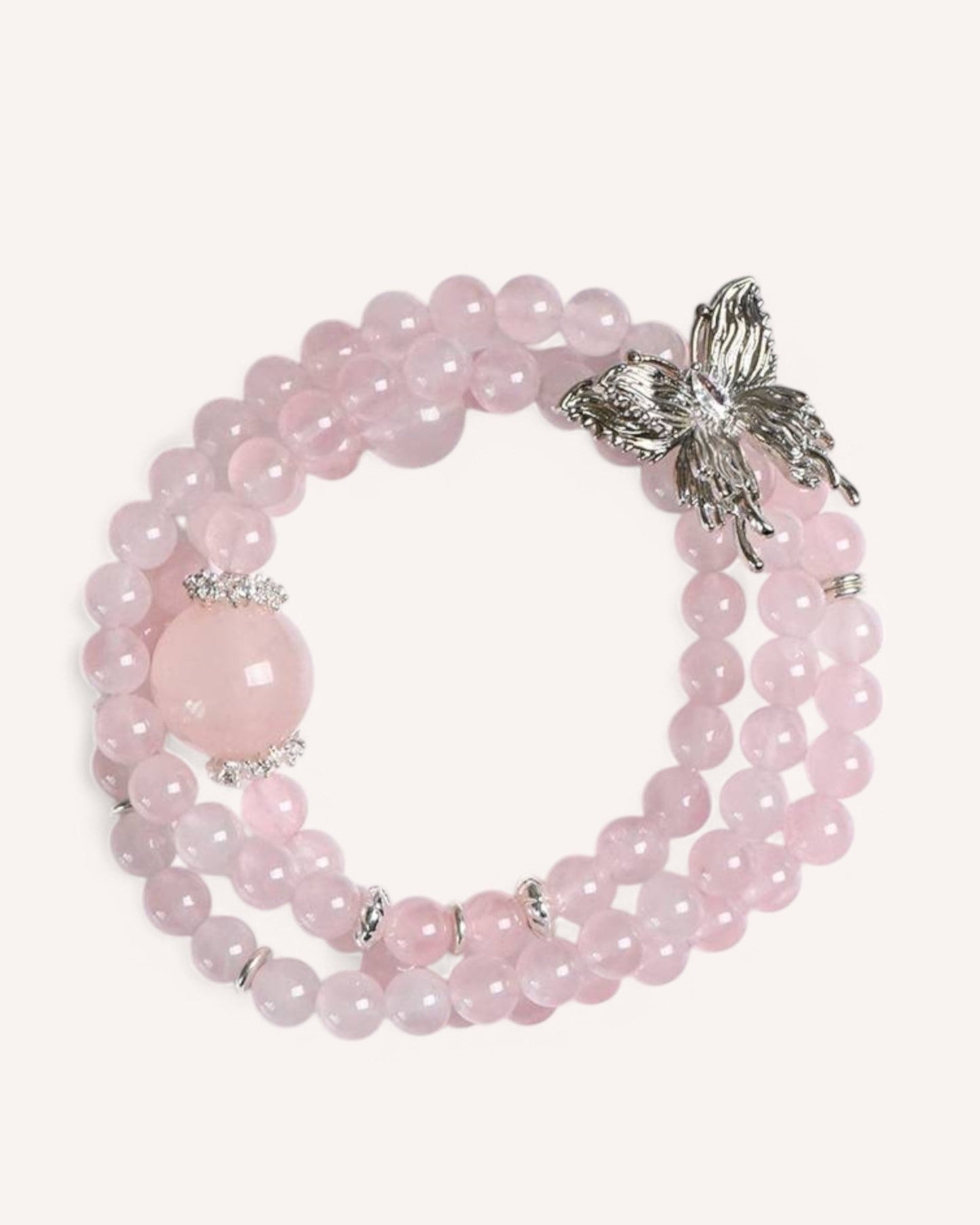 Love & Transformation Rose Quartz Butterfly Wrap Bracelet featuring a delicate butterfly charm and triple-layer Rose Quartz beads for self-love and renewal.