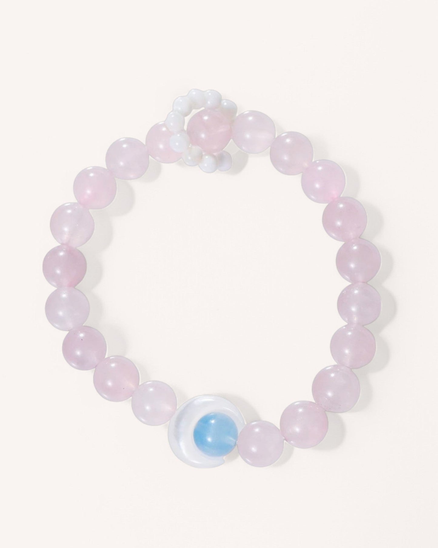 Top view of Rose Quartz, Aquamarine, and Mother of Pearl crystal bracelet for love, clarity, and serenity.
