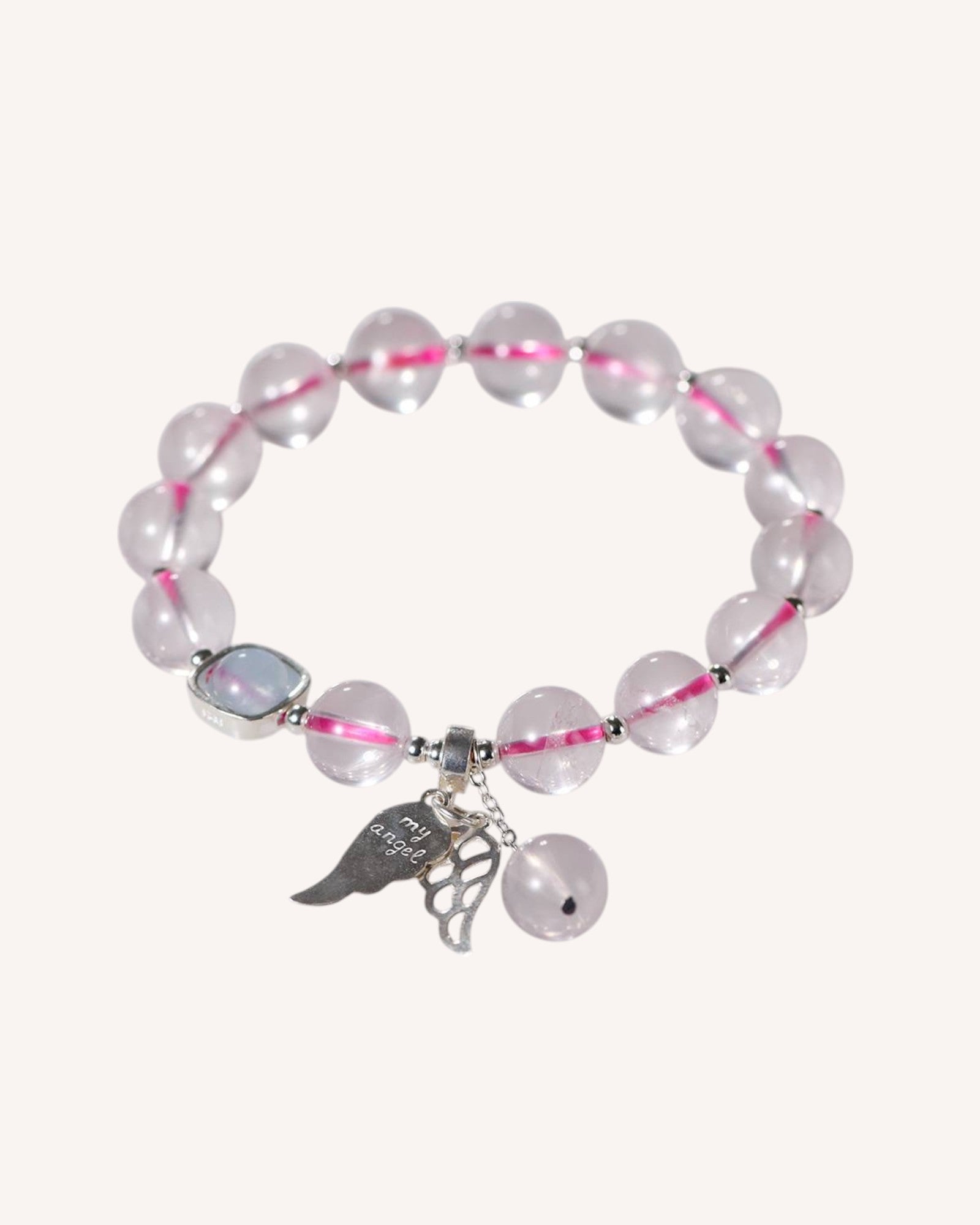 Front view of Rose Quartz and Aquamarine bracelet with sterling silver angel wing charm, symbolizing love, emotional healing, and spiritual protection.