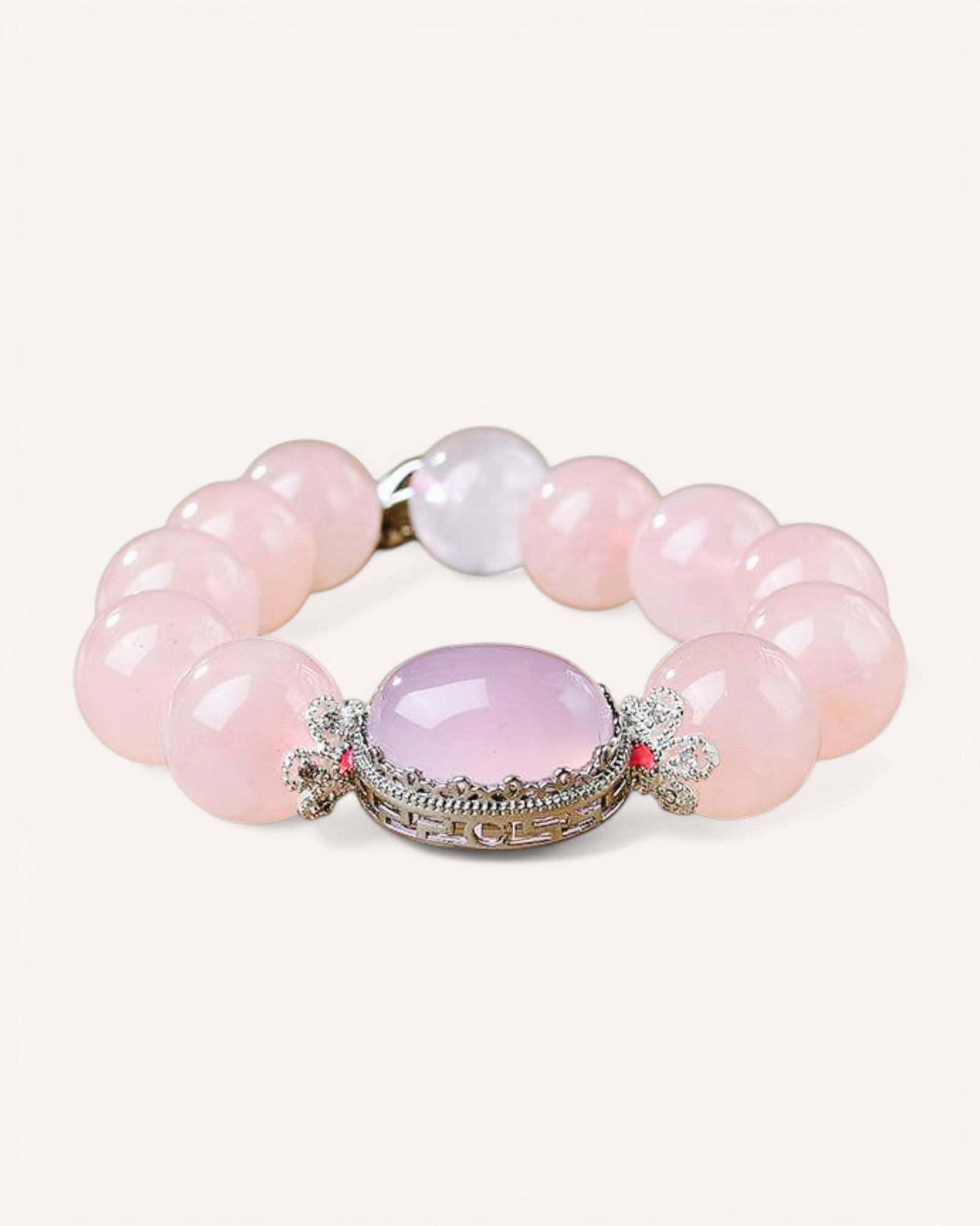 Close-up of a rose quartz healing bracelet with oval centerpiece, designed for emotional healing, love, and inner peace.