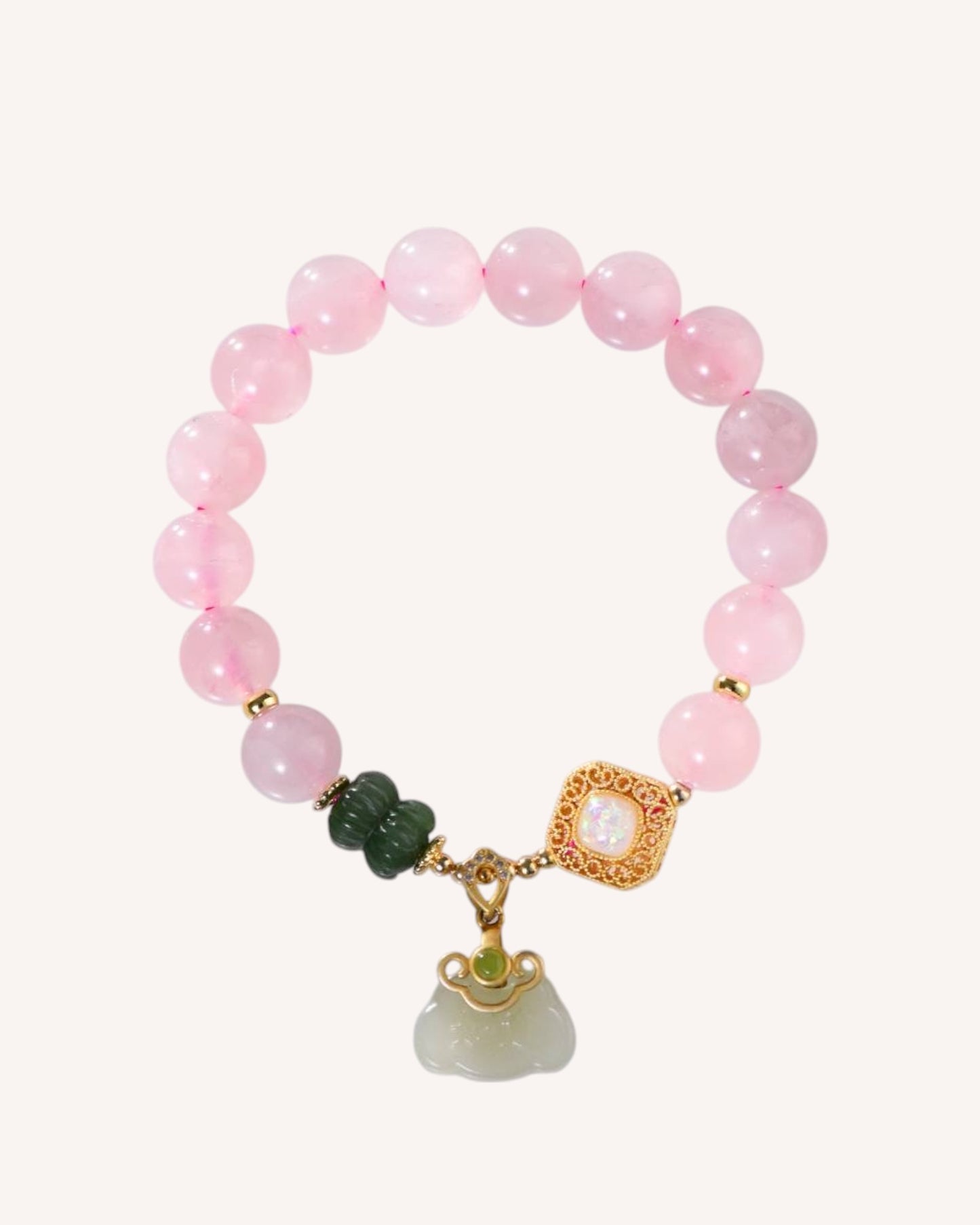 Rose Quartz and Hetian Jade bracelet with fortune charm for love, luck, and emotional healing.