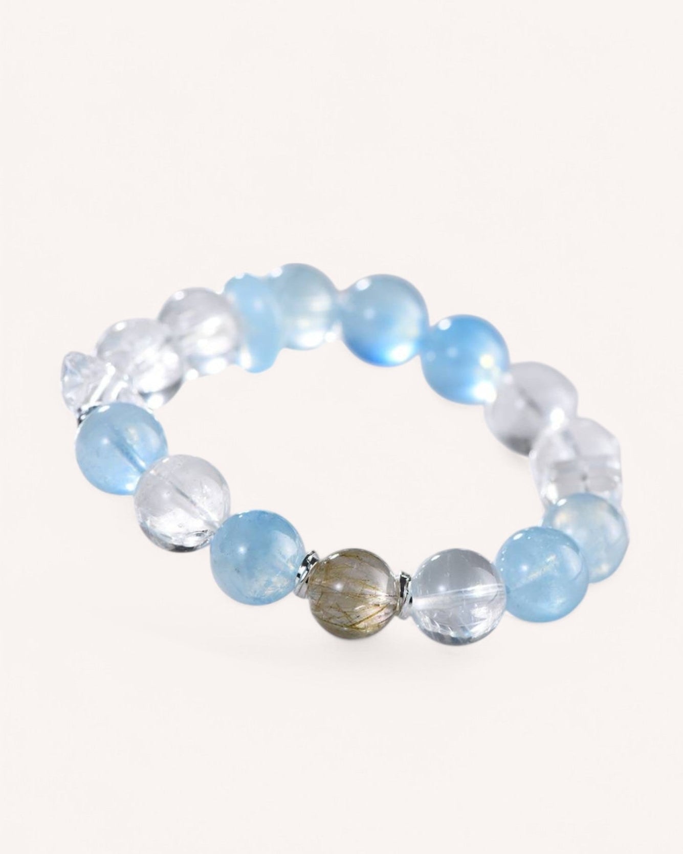 Elegant Tranquility & Prosperity Bracelet featuring Aquamarine, White Quartz, and Rutilated Quartz. A perfect accessory for calmness, confidence, and abundance manifestation.
