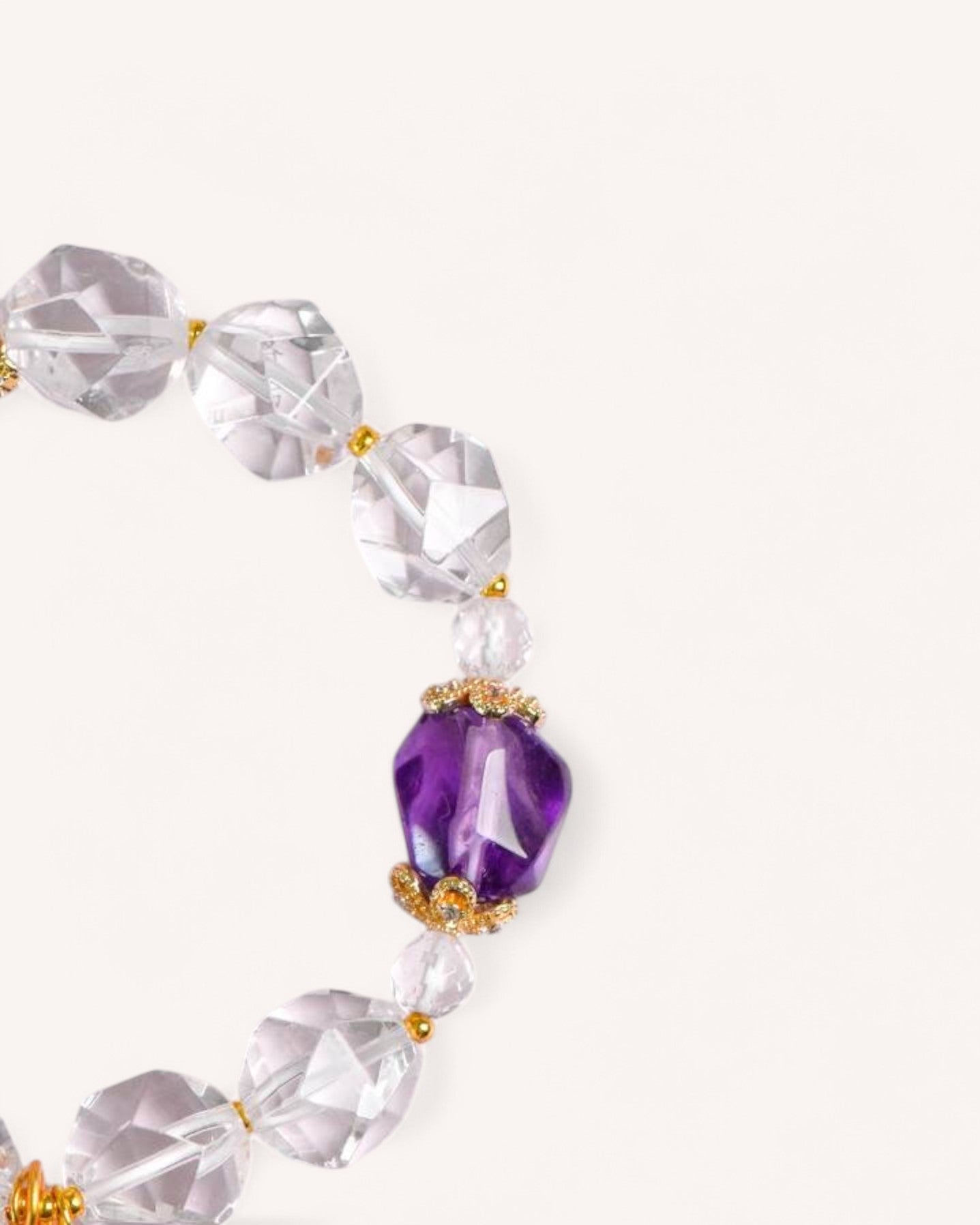 Side angle of White Quartz & Lavender Amethyst Bracelet, highlighting its delicate balance of clear quartz, amethyst, and intricate gold detailing.