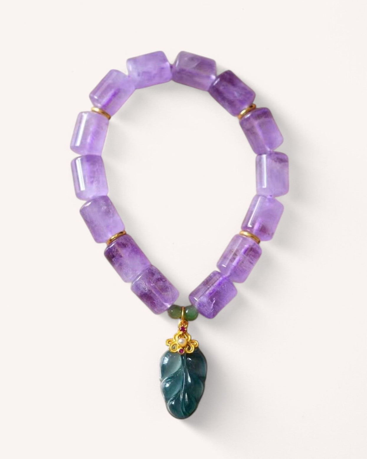 Lavender Amethyst Healing Bracelet for wisdom and serenity. Features rectangular amethyst beads and a jade drop pendant for balance and clarity.